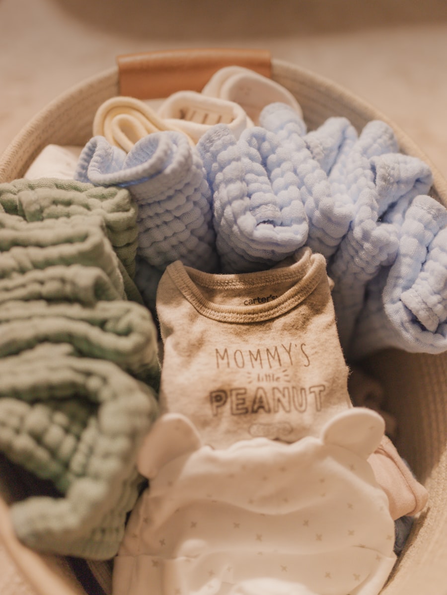 Folded baby clothes in a basket
